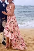This dress is stunning! I wore it to a Scottish beach wedding and received so many compliments. It's flowy with tiered ruffles for a romantic look. I'm 5'3 and even with 3" heels I had to get it altered. The XS was very fitted around the waist area but if I sized up to the S, it was loose fitting elsewhere. Overall I recommend! - Joselyne H.