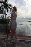 I am 5'3 and 100ish pounds. Finding clothing that fits me well is always a struggle. HOWEVER, I was so pleasantly surprised by this romper. I had high hopes after seeing it online, but the romper exceeded my expectations. I got many compliments on my outfit. I was initially worried about the tie area in the front, but I was able to wear a strapless bra. This is definitely a great choice for petite girls! It is so flattering! - Anita G.