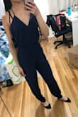 I bought this jumpsuit in navy, black, and olive. The navy is a gorgeous color and helps hides the wrinkles. The jumpsuit is super comfortable, good quality, cheap, and has pockets! Could be taken up a notch with a belt as well. - Jessica W.