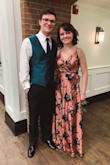 I wore this dress for a wedding in which my boyfriend was a groomsman, and it was beautiful! Because of my chest size I used fashion tape to make sure the front of the dress stayed in place, and a stick-on bra to give me some lift. The dress is crafted more in the front for girls who are more well-endowed. I wore 3-inch heels (that I bought on this site) and the dress was a perfect length; without the heels, it would have been too long. I'm wearing the heels in my picture. (the model in the picture has got to be really tall!!) The dress was quite wrinkled when it arrived, but with some careful ironing it looked great, and even through travel it never wrinkled as badly as it was originally. I got so many compliments, and would recommend this dress to anyone! - Haley S.