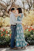 I bought this dress for my engagement photos and it fit like a dream. Even with a smaller chest, it wasn't too wide at the top and fits your curves nicely. It even has a secure tie in the inside of the waist before you do the wrap tie to ensure the dress stays together. The turquoise is beautiful and the quality is very good and a nice material. Perfect for spring or summer. - Erin T.