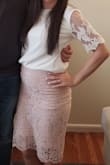 I ordered this skirt to wear for my bridal shower and it fit perfectly! It was form fitting, like how I wanted it to be, but wasn't too tight or uncomfortable to move or sit. Very pretty, and good length! - Kimberly S.