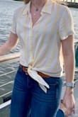 It's a beautiful shirt that is perfect for spring/summer. It can be dressed up or down. It's extremely versatile and light weight. - Alexis S.