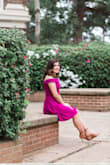 I got this dress for my graduation pictures and the small fit perfectly!!!! The magenta color is so beautiful and it really makes the skin pop! Also, the material is thick, which is nice if it is a bit chilly outside. Overall, I loved this dress and I can't wait for the rest of my pictures to come in! - Azalea R.