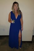 I wore this dress standing in my friend's wedding. I got so many compliments on it that day, and I felt absolutely fabulous in this dress! I loved the deep plunge, and high slit. I've always been conscious of my legs, I'm fairly short, but the slit was very sexy, but tasteful I felt. I did have to alter the length of the dress, and I had them take up the straps, as well as tried to thin them out a bit. This is one bridesmaid dress that I will definitely wear again. - Melissa G.