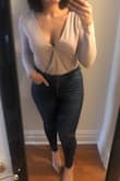 So I was picturing a color more on the beige side given the picture, but it is actually more pinky-grey than a brown tone. Either way it's still a great color and I love the bodysuit. The fit is great, the material is soft and good thickness. The cut is also good because you can leave it and wear a bralette or a little safety pin makes it appropriate for other occasions too. - Holly R.
