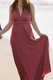 I wore a different color of this dress for my engagement shoot and loved it so much that I purchased the red burgundy color for my wedding rehearsal. The fabric is more stretchy compared to the "Always Stunning" dress. If you want the fabric to be more casual but still look beautiful, this is the dress. If you want the more formal look then go for the "Always Stunning" because that dress fabric / material is a bit more shiny and formal looking. - Mina L.