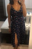 I love this dress! The color and print is fantastic and the slit adds just the right amount of sexy. I'm a bit on the shorter side at 5'2" and thought it would be too long, but it hit right below my knees for a good midi length. Would definitely recommend! - Sara C.