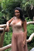 I bought this bodysuit to wear with a skirt I bought from Lulus. The color is great and the fabric is soft but it is a little see through and super low cut... with that said it didn't stop me from wearing it! I also bought it in a light blue which looks great with jeans. - Michelle S.