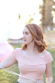 I have a bigger chest, so it made the length much shorter than the photos online. I didn't think about that when I ordered it, but it makes total sense. Still love it, it's soft and flowy. - Aimee C.
