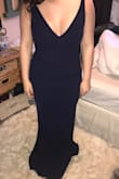 I wore this as a bridesmaids dress and it was beautiful! It is skin tight though so I would size up if in between sizes - Delanie C.