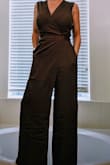 The color of this jumpsuit is what first sold me. Then I got it in the mail and was thrilled with the cut on top and the "faux-dress" front look that the bottom has. It's great with a pair of pumps on for me; or toss on a sweater or blazer and head in to the office.
I'm 5'0" so it's a bit long, most things are. A simple trip to the tailor to get a hem and I'm going to be in style for spring. - Ashley H.