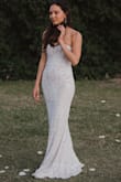 This dress was amazing to dance in on my wedding day. It is heavy material but not too warm, and it stretches so it hugs all the good curves. Worth every penny. - Mary F.
