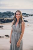 I got this dress to wear for a family photoshoot in Maui. It felt amazing and I loved how it looked in pictures. I ended up having it hemmed for length so I could wear it barefoot, and I had the seamstress also sew the front together just a little so I wouldn't have to worry about it gaping in the pictures. I think it would have been find without, but it made me more confident while taking photos. Overall I recommend this dress - I felt great in it. I like that there are different ways to tie it, and I think I would experiment with that next time. My bust is on the small side, so I bought a backless stick-on bra that worked well. The dress with that bra made me look busty! - Ramah R.