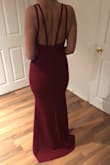It fit like a glove, the material is not thin so doesn't show underwear, bra, etc. The back is perfect. It's long, so looks like it has a tail. I love it! In the picture it looks brighter than it is, it's more of a burgundy color! - Marina S.