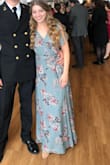 I purchased this dress to wear to a military event, and it was perfect! I did have to get it altered because it was too loose for my comfort in the chest area and a little too long even with 5 inch heels on. The material is lightweight and comfortable. It does wrinkle slightly. - Sarah W.