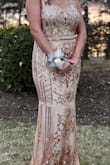 Wore it for prom and it fit really well and was still pretty light even with the sequins. There was a hole in the shoulder when I received it, however. - Rachel D.