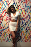 It fits perfect. The skirt is a little long, but fits me well because I have long legs. Bought it in every color. I also love that I can wear a bra with it. - Jade H.