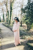 I ordered this dress to wear for my maternity session! And it was perfect! I usually wear a M and ordered a M. So I would down size for sure. - Vanessa E.