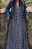 This Maxi is really cute! I'm pear shaped and the XS was a bit large to fit my 32B top but the flowy style covered my M-L sized bottom no problem. The fabric is thin but not see-through which is great for the Summer. The straps are definitely a bit tricky. Since they're not adjustable, to alleviate the size issue I tied the front straps to make a halter top. I could probably cut the back straps off permanently but tucking them into the back of the dress worked in a pinch. The halter style didn't seem to hinder the look of the dress in any way and fit just fine! Another bonus of the halter style is that I was able to decrease the length a bit so I didn't have to hem the dress. I paired it with flat sandals no problem. Unfortunately I'm wearing a jean jacket in the photo which covers the straps - the dress was so cute I was determined to wear it despite the temperature! - Deanna L.