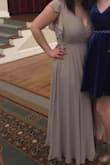 Loved the color and the fit of the dress. It was a little long for me, so I had to get alterations done, but overall I loved it. - Nicole N.