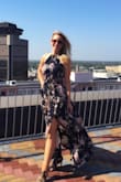 This dress is everything! I like how depending on the type of look I am going for. I can tie it up right near my neck, or loosen the halter just a little bit for a night out. This dress has a lot of fabric. I wear it to work on occasion and as I walk through the city the flow of the dress behind me garners tons of compliments. I can't imagine someone shorter than my height wearing this and walking comfortably. I wear it with 3-4inch heels and it works(just not easy to walk up or down stairs in!) the taller you are, the better this dress will fit you, but it works for me. - Andrea S.