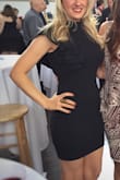 This dress is amazing. It's a thick material, hugs curves well with a small bit of stretch. The shoulder is elegant and adds a touch of class to the dress. I've worn this many times and love the way I feel in it each time! - Andrea S.
