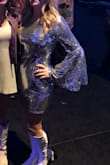I bought this dress for a charity disco event and received so many compliments! I was sparkling as much as the disco ball that night! There is NO stretch to this dress. I am usually a size small and if fit perfectly, but if you are in the fence I would size up as there is no give to this dress. - Andrea S.