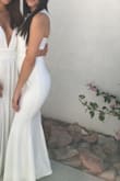 I loved this dress. It was exactly what I needed and it fit snug and was amazing. I had to have it hemmed because it was too long but after that it was perfect and the color was a true white. Really nice fabric that doesn't wrinkle. - Crystal L.