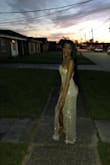 This dress is true to size and fit my 16 year old perfectly. She's wearing an extra small. Beautiful dress for prom. - Wanetta S.