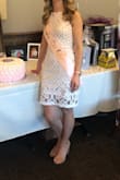 Lining is more of a blush than tan. Really cute and flattering fit! Little big in the middle section compared to the top or bottom of the dress but still like the dress. - Jaclyn H.