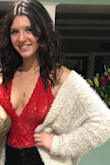 This bodysuit is so comfortable and fits perfect! The material is high quality and very appealing! It's kind of revealing, but super cute! Especially with jeans! Best bodysuit I have ever worn by far! - Elle H.