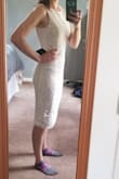Bought this dress for a my bridal shower. When I put it on I felt like I was going to a business meeting. The tan was nice below but I felt it took away from the lace. Dress is much longer in person. I'm 5'6" and it was well past my knees. I was worried about the slit in the back, felt if I bent over someone would see my underwear. Decided to go with another dress since this one didn't fit my event. - Angelina S.