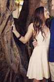 Wore this for engagement photos and it was perfect. Lined and very think material so no risk of being see through which is nice since it's difficult to wear a bra with. Def not bright white. - Rebecca B.