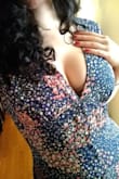 I went back and forth on the sizing of this dress and almost didn't buy it because of the description and the reviews. I'm so glad I did end up buying it, and went with a medium instead of a large, since the v neck would have been way too low on me and the waist too baggy. It gives me more cleavage than I'm usually comfortable with but nothing a cute little lacy bralette can't handle. Seriously, just get this dress! It is much more beautiful in person. It's very demure and "country girl" looking with just a pinch of sexy! I do think it's made for bustier women. - Jessica P.