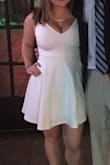 I ordered this dress with the intent to wear it to graduation but I'm a little busty so this dress was a bit too revealing on me. I saved it for my sorority formal and it looked so cute! The straps were a little long on me but nothing a couple safety pins can't fix! It fit me very well lengthwise as well, so if you're on the tall side this dress might be too short. The material is pretty thick and well made. Overall a great dress! - Janine M.