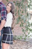 I purchased this skirt for a family Christmas photo shoot. I paired it with a long sleeved cream colored shirt and tan booties. The skirt was comfortable and did not ride up. It does run a little big on the waist area, so if you're between sizes I would recommend you size down. - Maite M.
