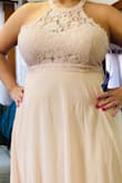 I bought this dress for a wedding. I liked everything about it except that it fits a little loose on the top. I wear a size 42C bra. It is also long even with heels on. Other than that, it is exceptionally beautiful! - Alexis H.