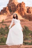 I picked this dress for my Sedona wedding and it was just perfect. I had the bottom altered only because I wore flats and didn't want to have the bottom dirty from the red soil. The lace back folded out a bit when I moved my arms up but the lining was perfect for pics to make sure the dress was not see through. Overall an amazing dress! - Tina R.