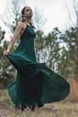 Got this dress to wear for a friend's wedding as a bridesmaid. It is a beautiful dark green color and is made out of great quality, flowy material. I normally would get a small, but got an x-small based on other reviews, and it fits perfectly! It's quite long for my height, but nothing heels can't fix. Absolutely no regrets about this dress! - Sara C.