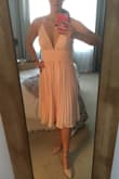 Was pleasantly surprised at the quality of this dress. It's a flattering flowing chiffon dress. Very happy with my purchase. Got it for a steal on clearance. - Elisa A.