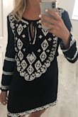 The material is great but it did look a little more grandma when I tried it on. I think the gold sequence through me of a bit. And the fit was weird. Loose and flowier up top but than at the bottom it gets tighter. Really wanted to love this one but just wasn't for me. Ended up returning. - Renee B.