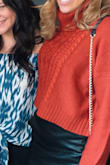 This sweater is fits cropped like shown on the model, is super comfortable and warm. - Nicole R.