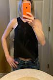 This top is awesome for a night out or a concert but I don't see how anyone could wear a bra unless it is cut low. I tried it on with a full coverage bra which you can see in the pic. Will return because I just don't know how I could make this work with my abundant selection of bras. - Sarah B.