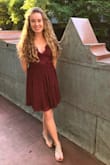 Bought this dress for my daughter and she absolutely loves it! Super comfy dress that could easily be dressed up or worn casually. Lace top has beautiful detail and bottom material is flowy and nicely put together. She received so many compliments and would love to own it in black too! Only one complaint is that it is very low cut and for a small chest will need to wear something underneath in the future as it gaps, maybe xs for future dresses. - Daidra C.