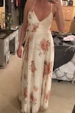 I got both Small and XSmall to try on both. I went with the XS because it fit my chest area better, I could have gone with the Small as well but it was slightly a little bit in the breast area. I love the ties, the slit in the dress, and the button clasp at the chest area. Also, I am 5'7" and wearing 3+ in. heels and the dress just barely hits the floor. Oh and also the fabric is beautiful! Perfect! =) - Jessica U.