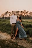 I wore this dress for my save-the-date pictures! I absolutely love it! It was so flowy and draped beautifully whether I was standing or sitting. So girly and elegant! It's a wrap dress so you can adjust the fit to your comfort. I definitely recommend it! - Helen M.