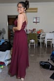 The dress fit me superbly at the bust but was quite loose for me at the waist area. I have a larger bust than normal, so I get this problem quite often with other dresses as well. I went to get it hemmed and altered at the bust so it would fit me better, and I absolutely love it! The fabric is nice and flowy and is really weighted. The lace at the back is super elegant and sexy too. I'm glad I bought this for my PROM, and I don't think I would have loved any other dress as much as I love this one. - Celine G.