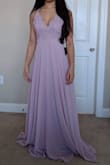 The material feels great! Will need to get it tailored to fit my height but that was expected. Pretty color in person and can't wait to wear it for my friend's wedding! - Stephanie C.