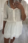 This runs WAY large. I feel like I'm swimming in it. I guess for being a cover up it's supposed to be, but I wish I sized down. It's very cute and thinking maybe it'll shrink in the wash. And as you can tell it is see through, but I wanted that. It's main purpose for me is a beach cover up. Very breathable material. - Renee B.